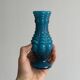 Small deep blue vase with reliefs