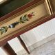 Wooden dressing table with olive green chair and floral patterns