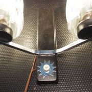 Pair of wall lights from the 1950s-1960s with a push button switch.