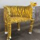 Wooden armchair with a "tiger" appearance.