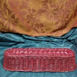 Old bread basket for baguette or red banneton in woven wicker