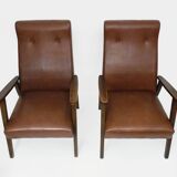 Pair of Scandinavian armchairs in brown leatherette and wood from the 50s and 60s