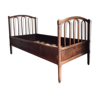 Old curved wooden bed - one person
