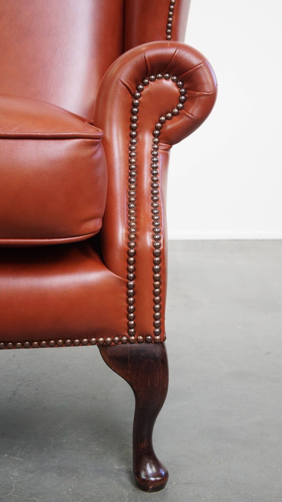 Elegant smooth English cowhide leather Chesterfield wingback armchair