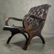 Vintage Chesterfield armchair in dark brown leather / single seat