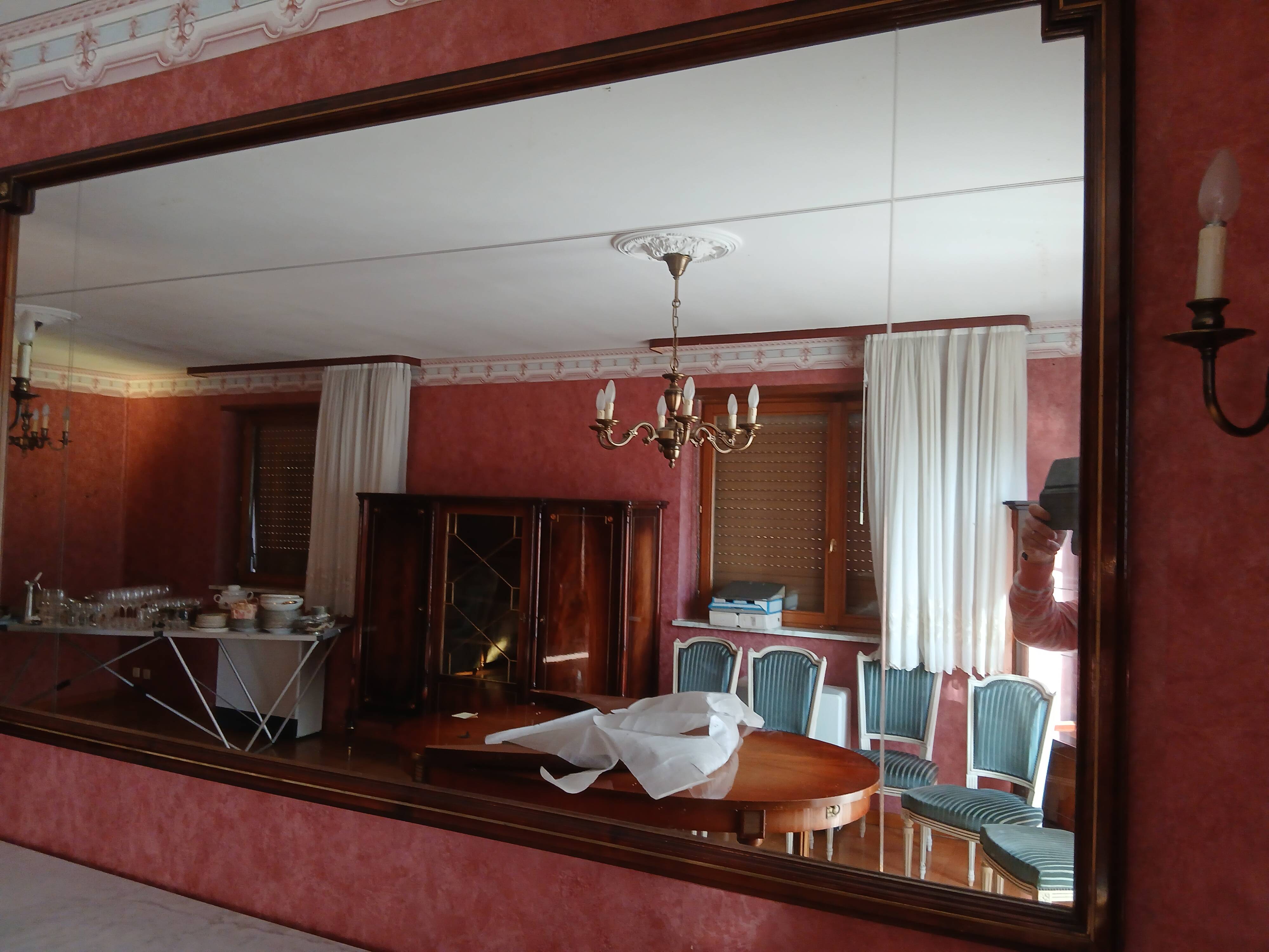 Mirror matching the 4-door mahogany sideboard