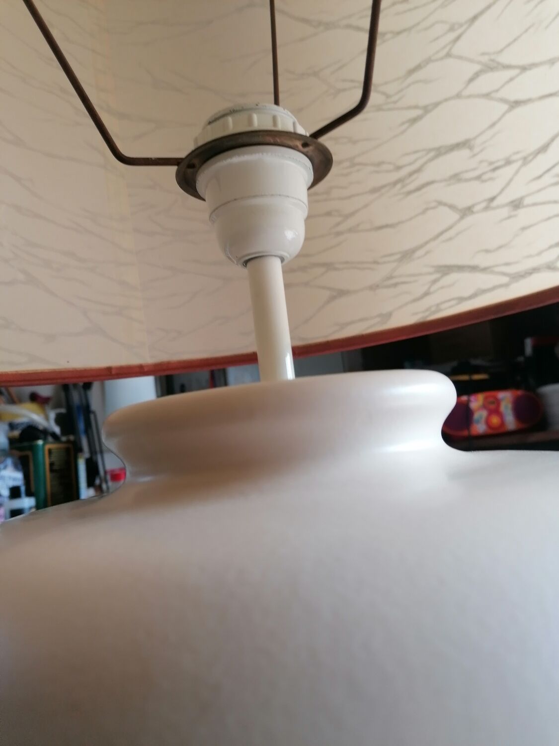 Vintage ceramic table lamp and golden lampshade.