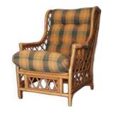 Vintage armchair in bamboo and rattan with a tartan pattern.