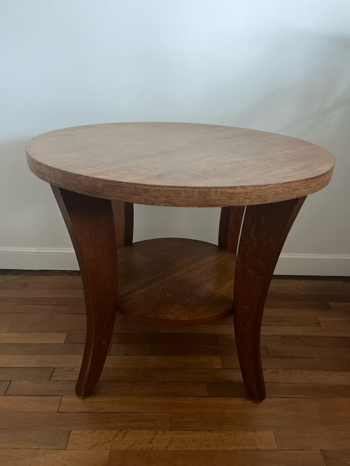 Low round art deco table in honey wood