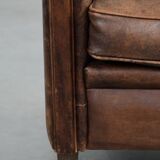 Vintage sheepskin armchair with warm colours and a characterful appearance