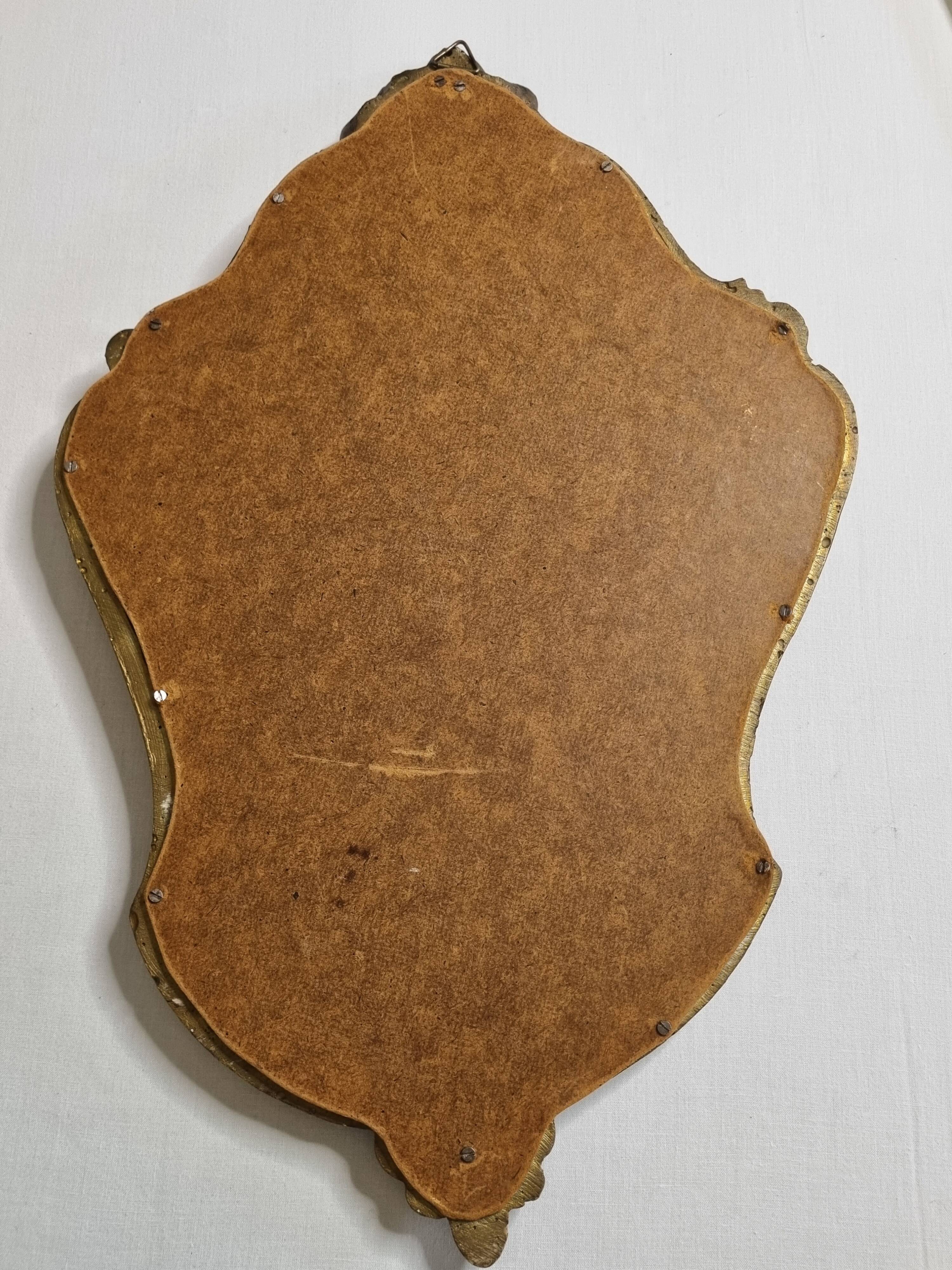 Antique rococo mirror in patinated gilded wood with shell decoration 49 x 31 cm