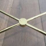 Brass coffee table upholstered in black leather. In the style of Jacques Adnet.