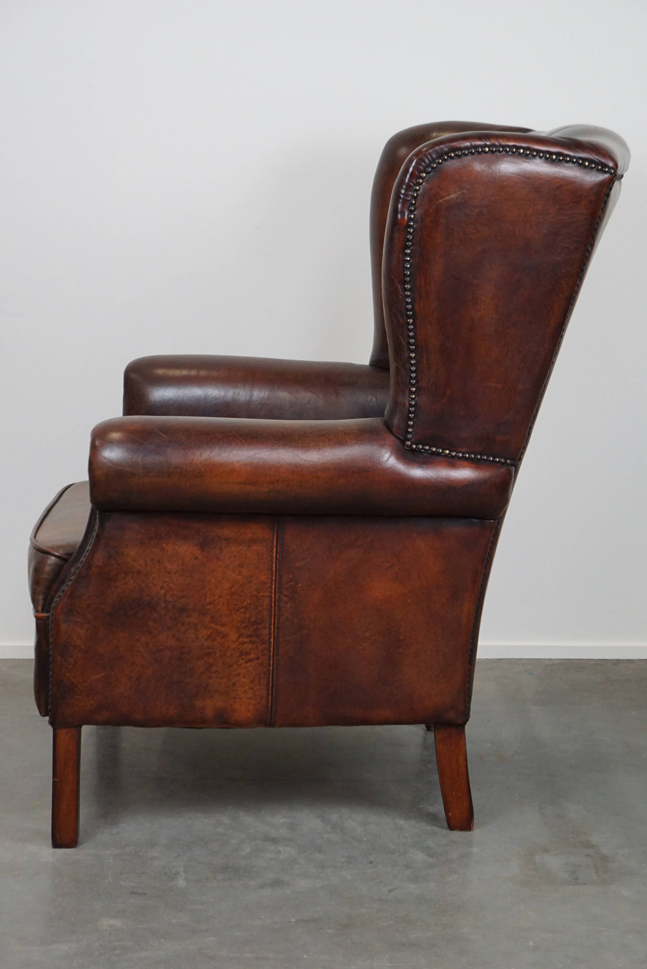 Large Sheepskin Leather Wingback Armchair with a Fixed Seat Cushion and a Stunning Patina