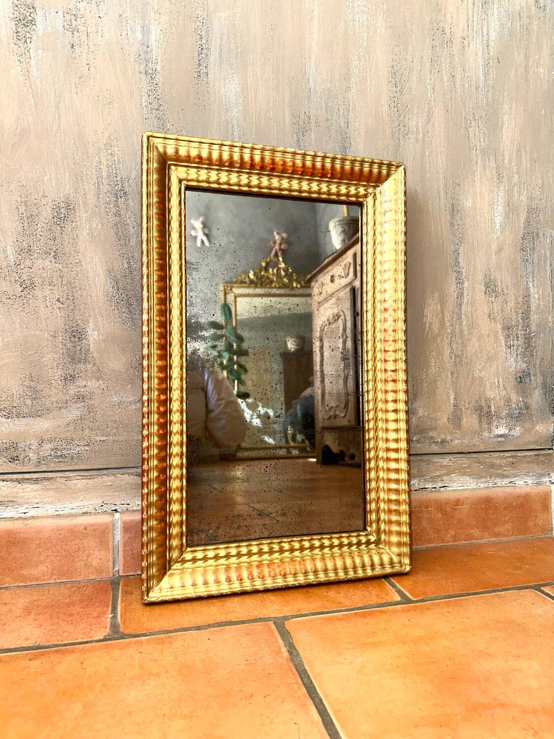 Antique gilded mirror from the Directoire period, 19th century.