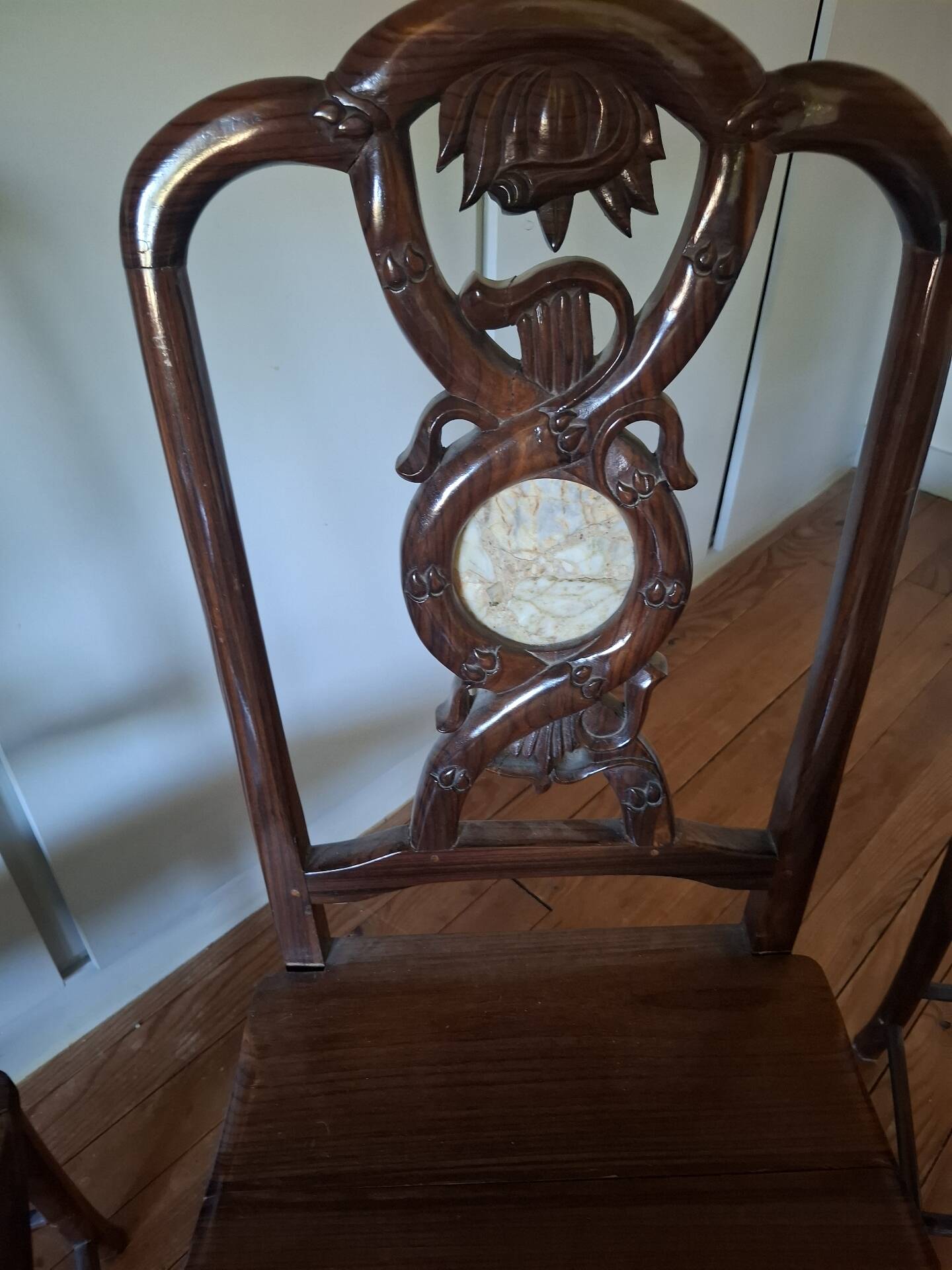Sculpted chairs in solid wood