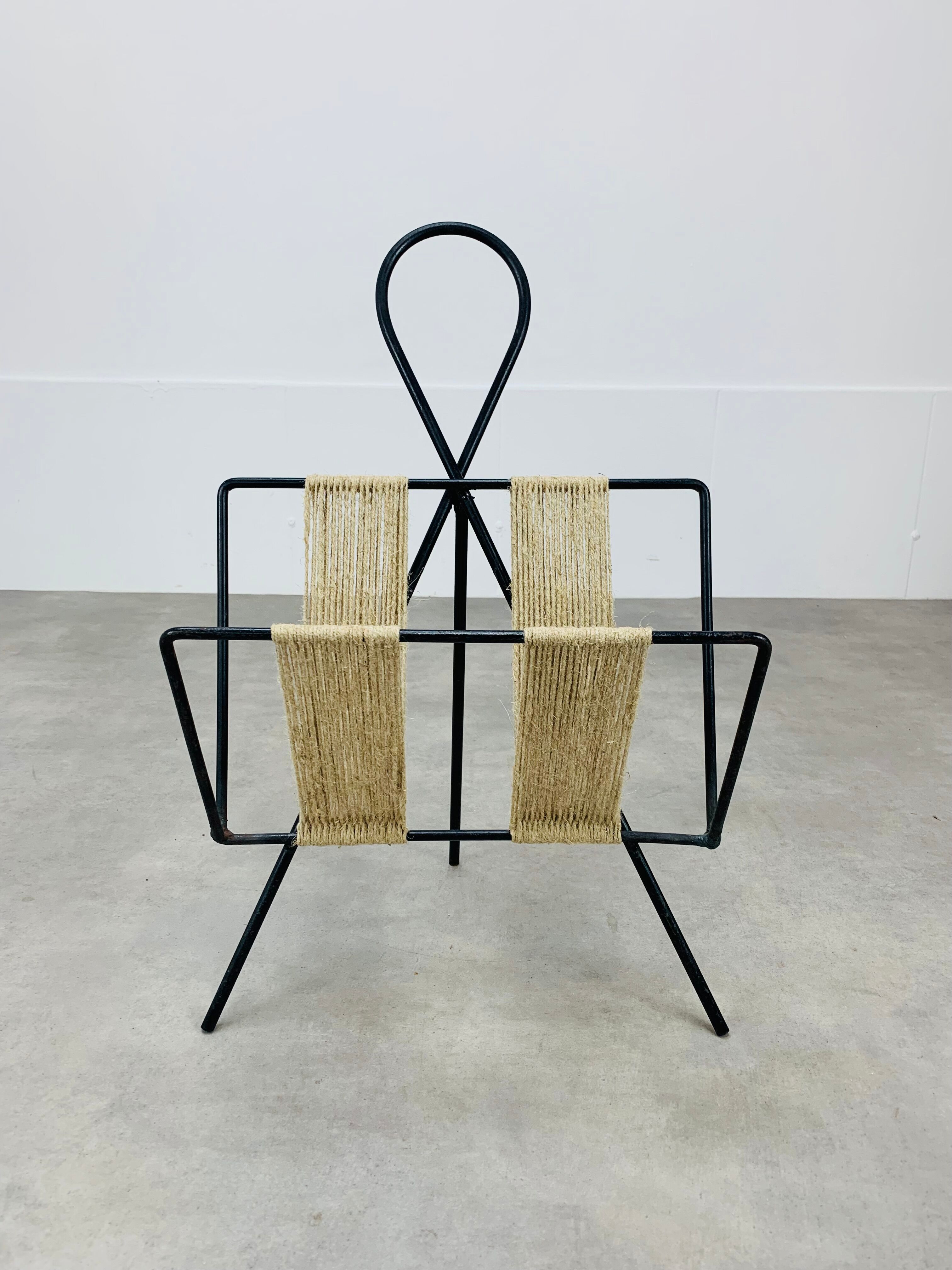 Tripod metal and rope magazine door 50s