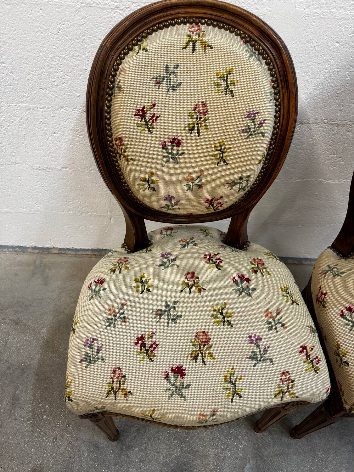 Pair of Louis XVI medallion chairs with canvas.