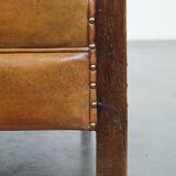 Cognac-colored sheepskin and wooden Art Deco design armchair