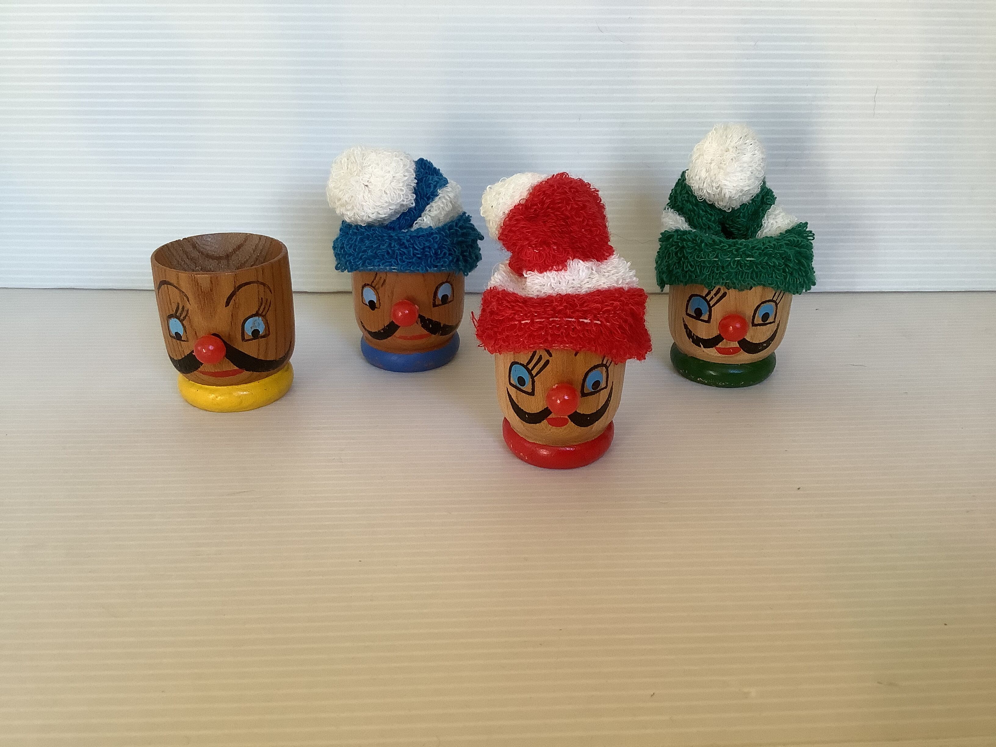 4 old wooden egg cups
