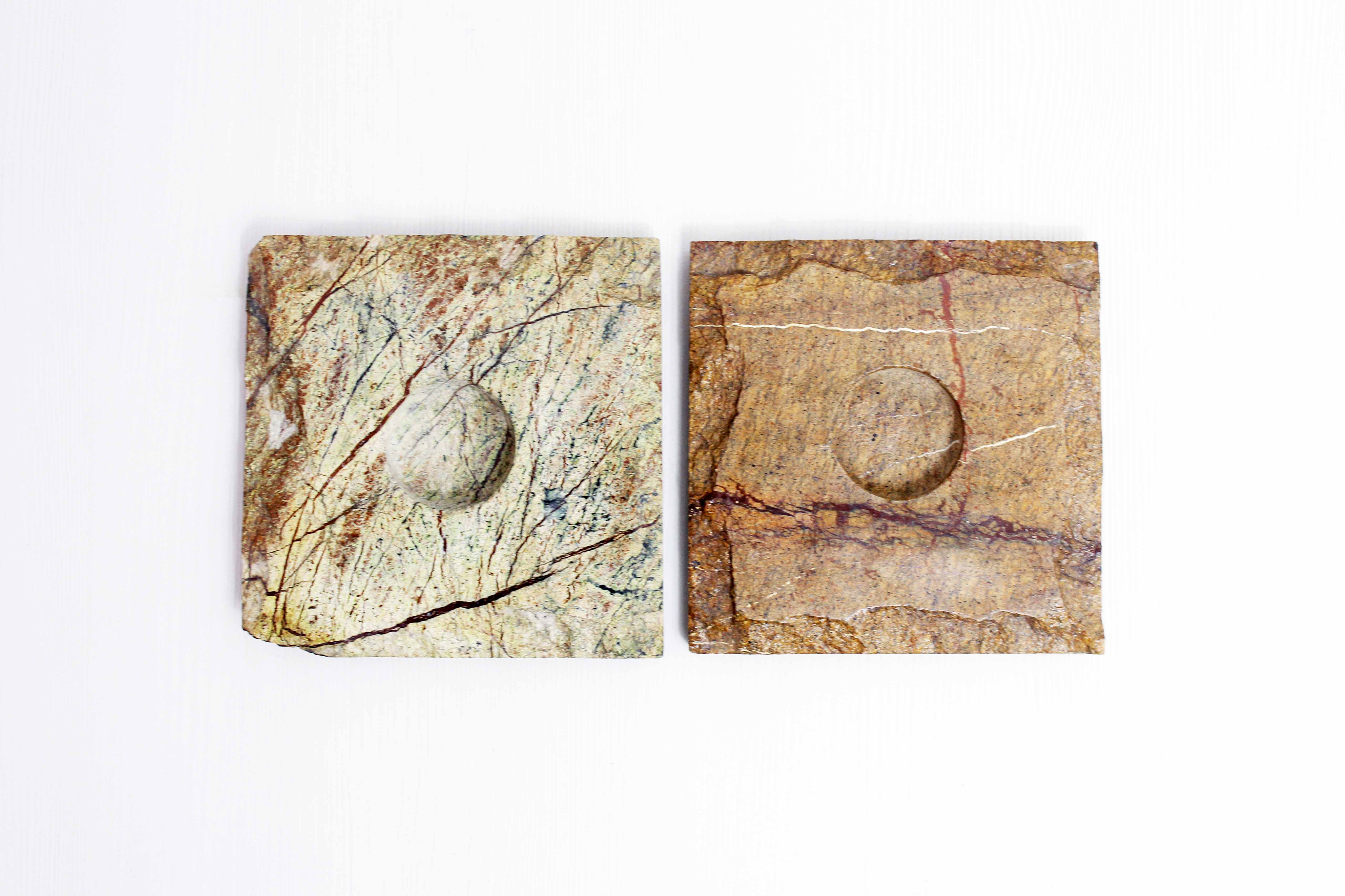 Pair of brutalist travertine candle holders