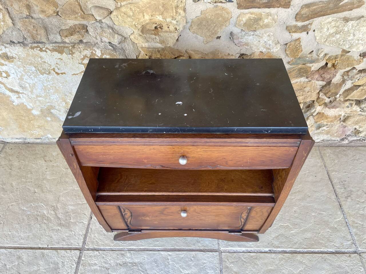Art Deco bedside table in walnut, black marble top, circa 1920.