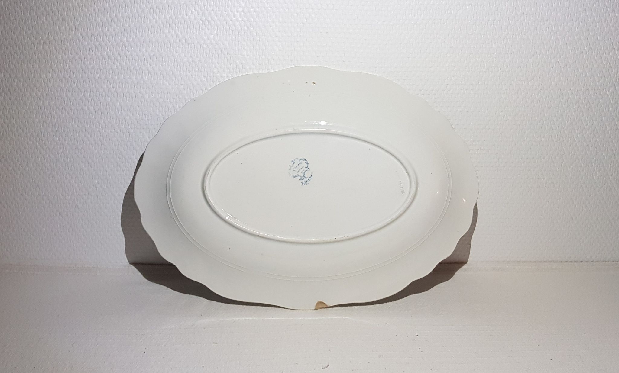 Oval dish of the earthenware factory of St amand Regency model, iron earth