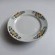 Old round footed plate signed Labrut brothers flowers