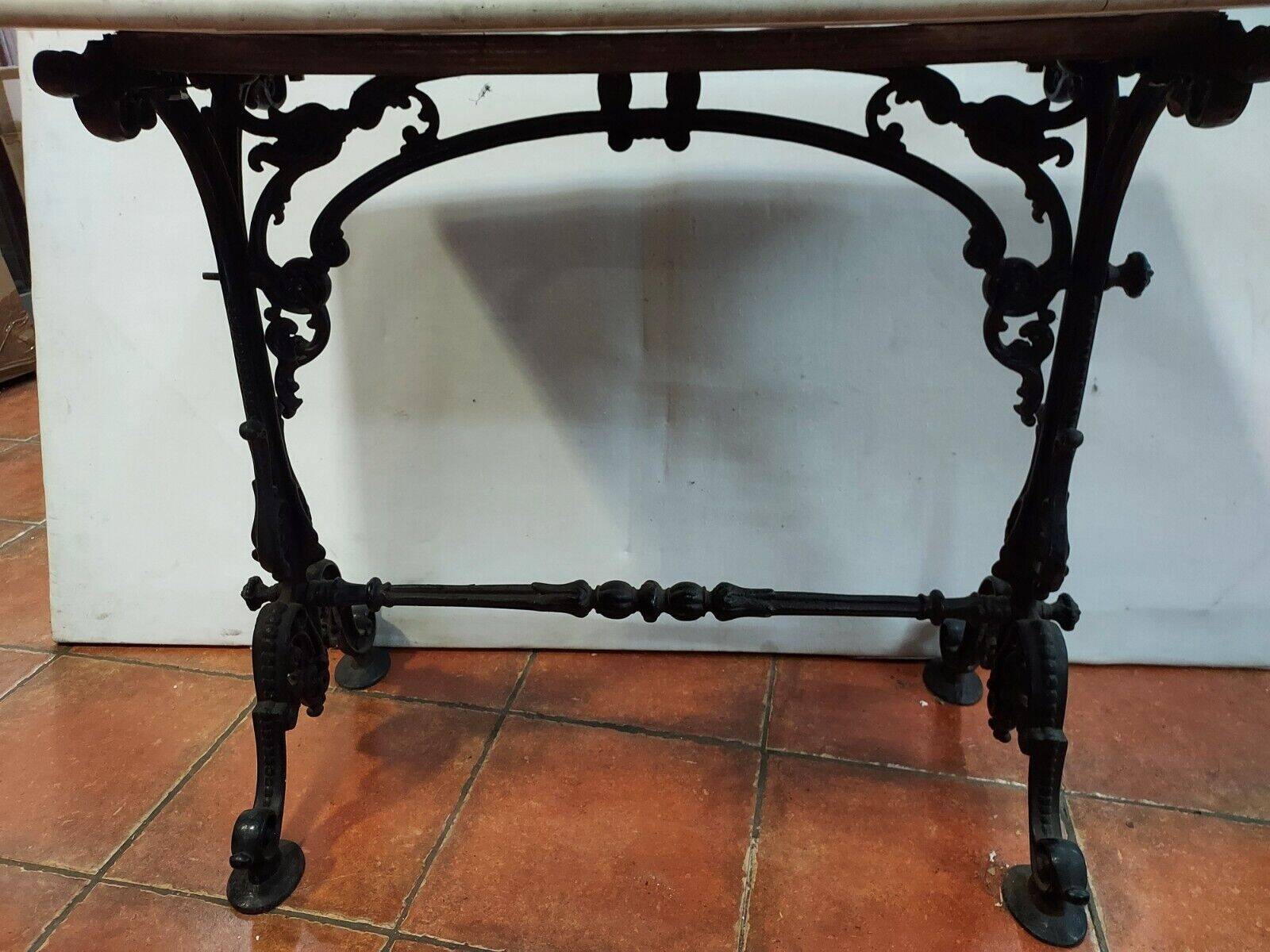 bistro table with cast iron base and marble top