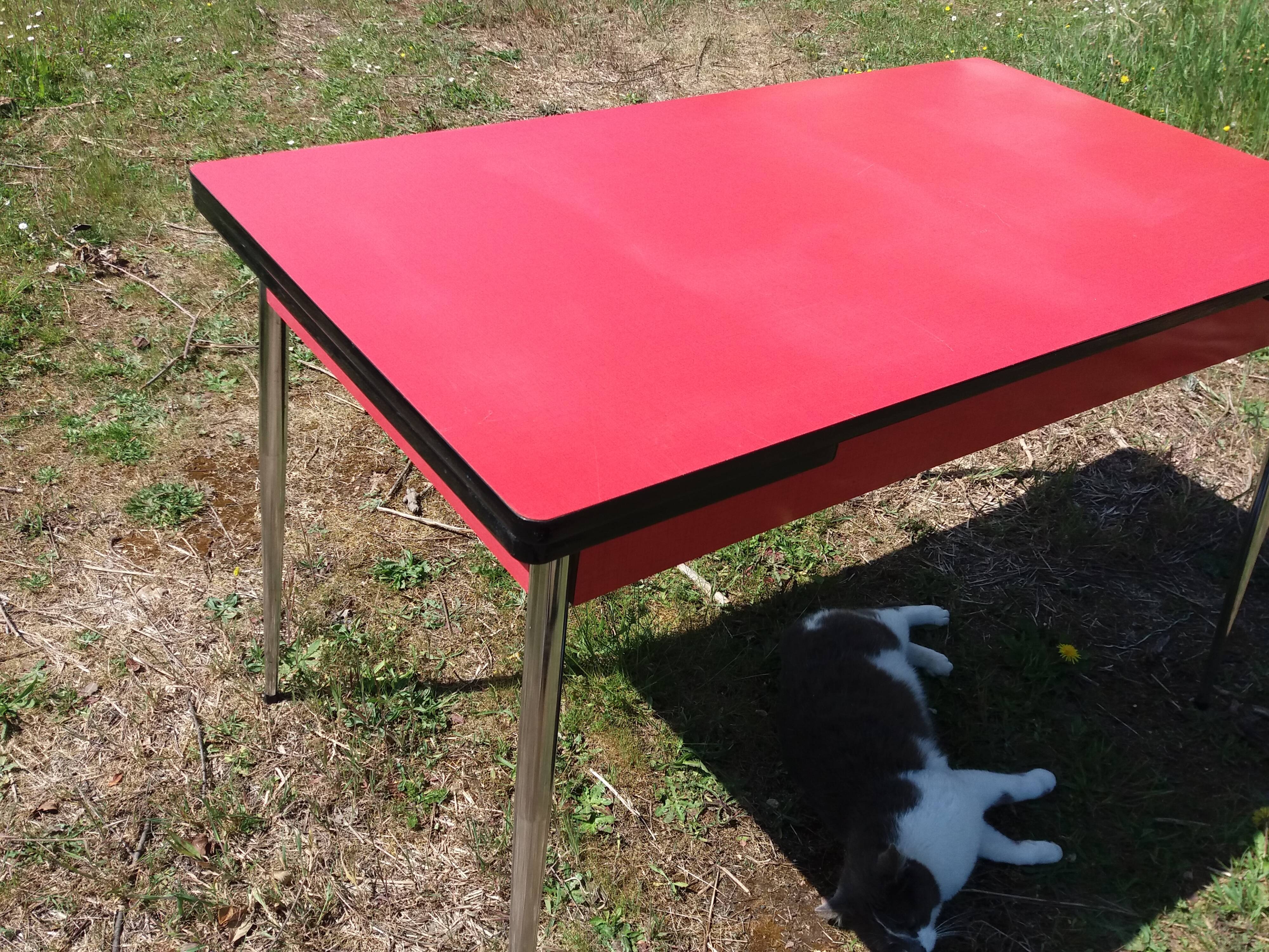 Dining table with red formica extensions