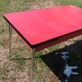 Dining table with red formica extensions