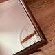 Folding mahogany table with a mirror top.