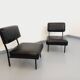 Set of 2 vintage modernist armchairs in black faux leather and metal.