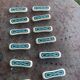 Set of 12 knife holders in green and beige glazed ceramic, slip,