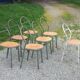 Set of 7 metal chairs by René Herbst with wooden seats.