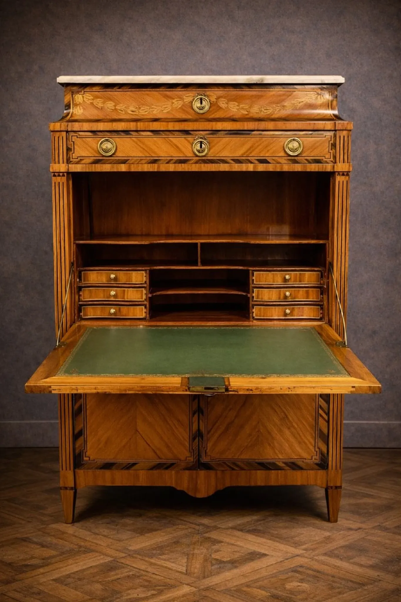 Secretary from the Louis XVI era in precious wood marquetry.