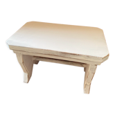 Patinated wooden footrest.