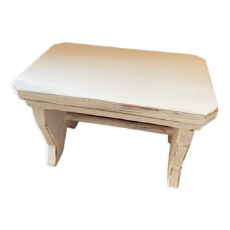 Patinated wooden footrest.