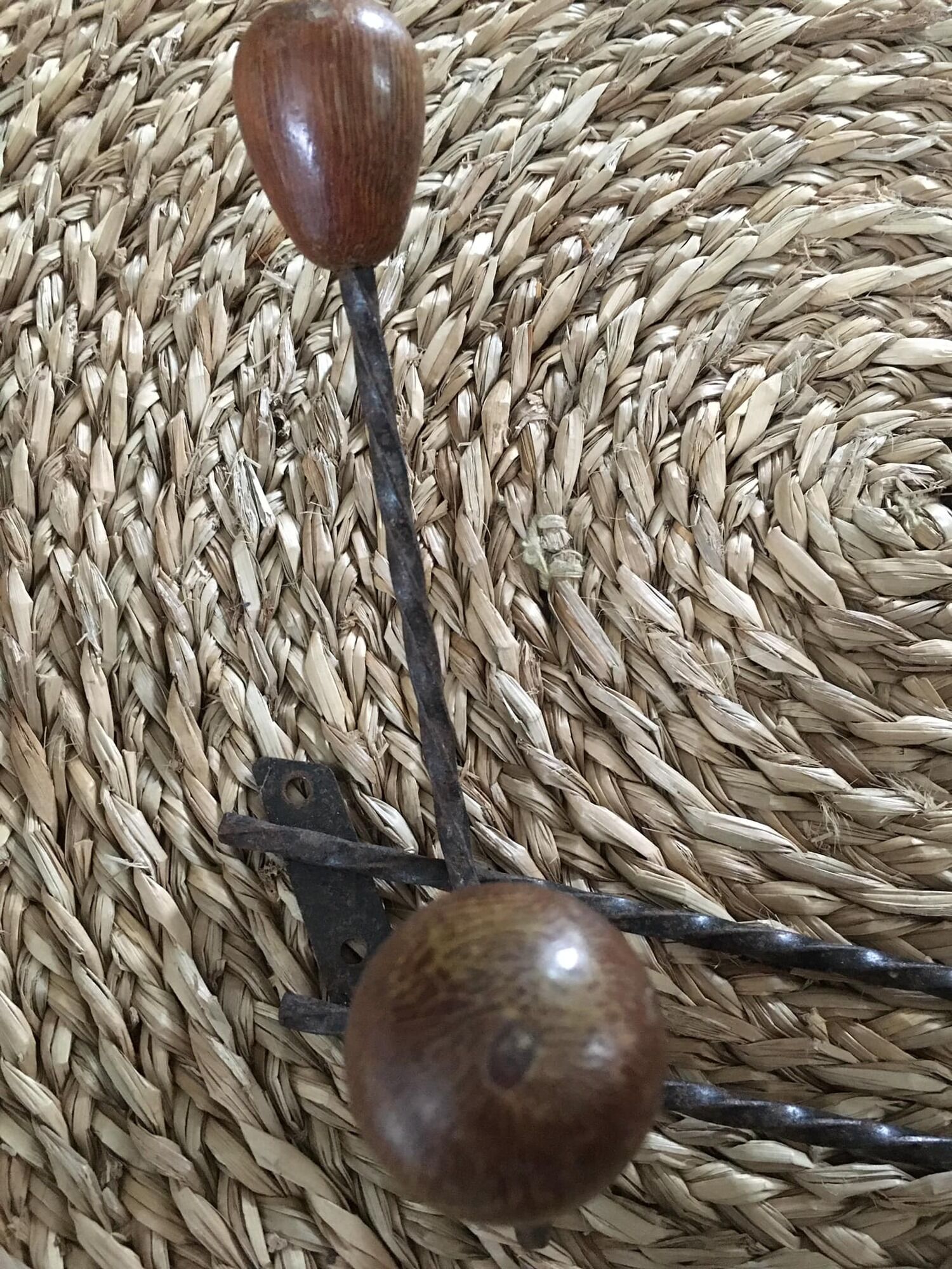 Old wrought iron coat rack. 4 hooks in chestnut wood