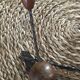 Old wrought iron coat rack. 4 hooks in chestnut wood