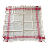 Old cotton tablecloth with flowers and fringes
