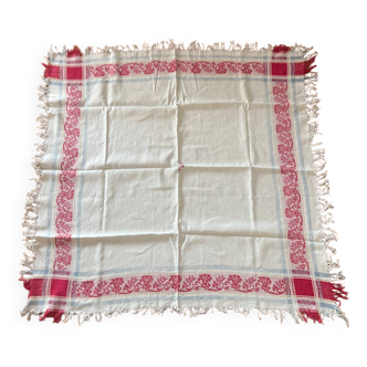 Old cotton tablecloth with flowers and fringes