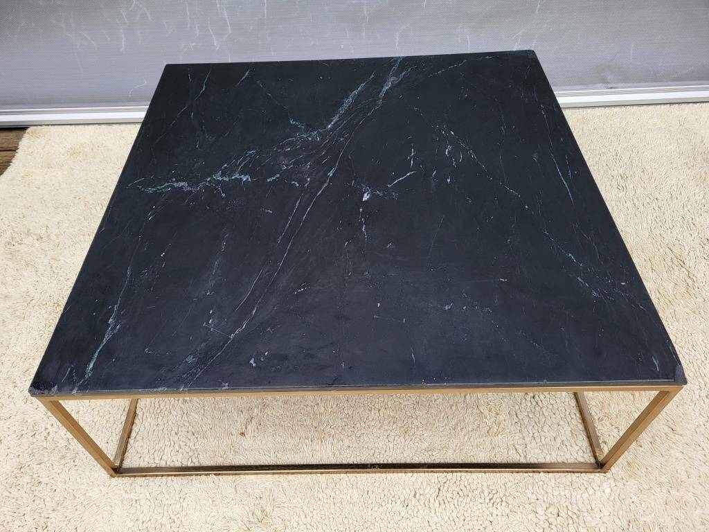 Coffee table or black marble and brass display "in its own juice"