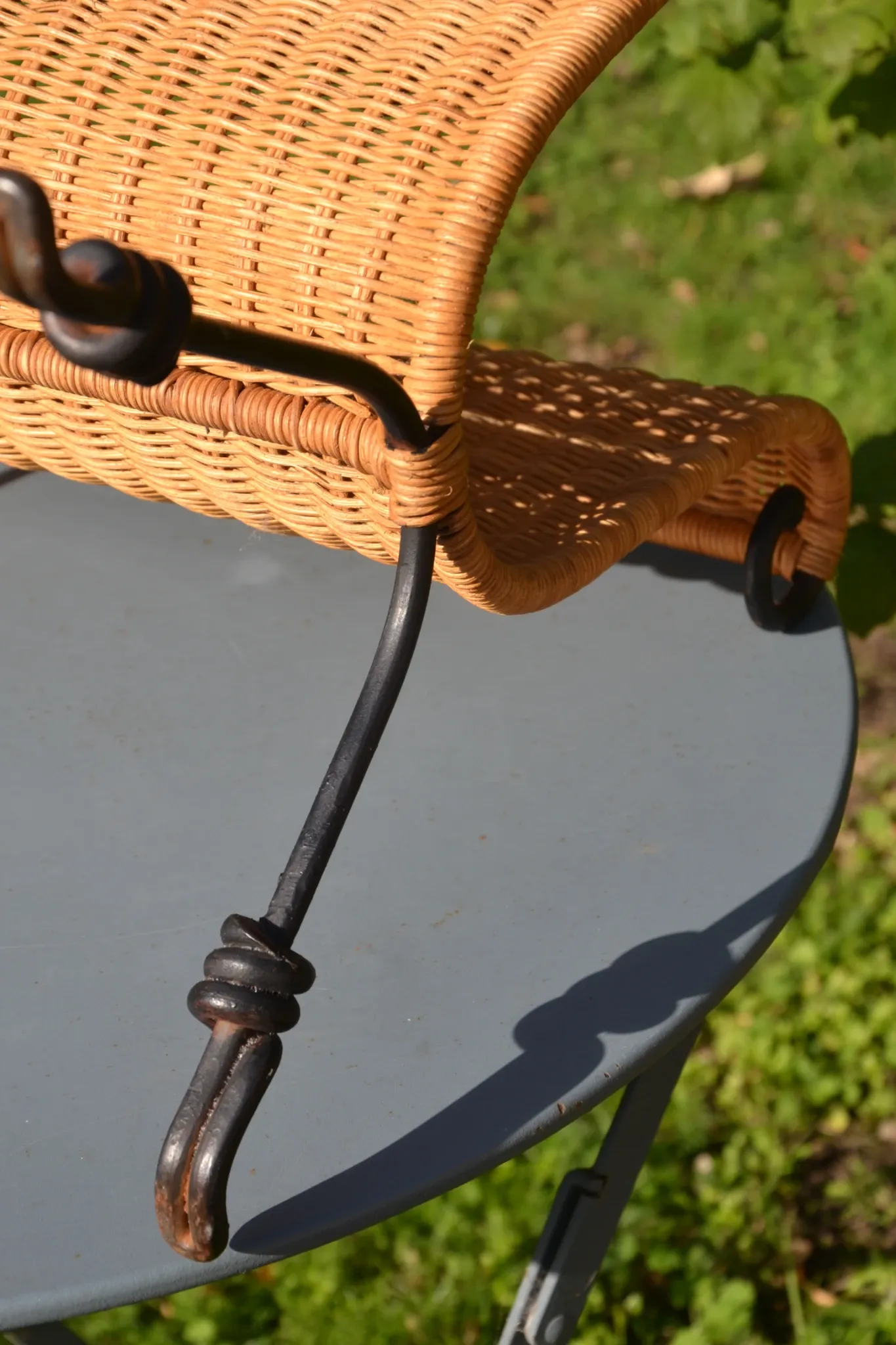 Wrought iron and rattan magazine/newspaper rack