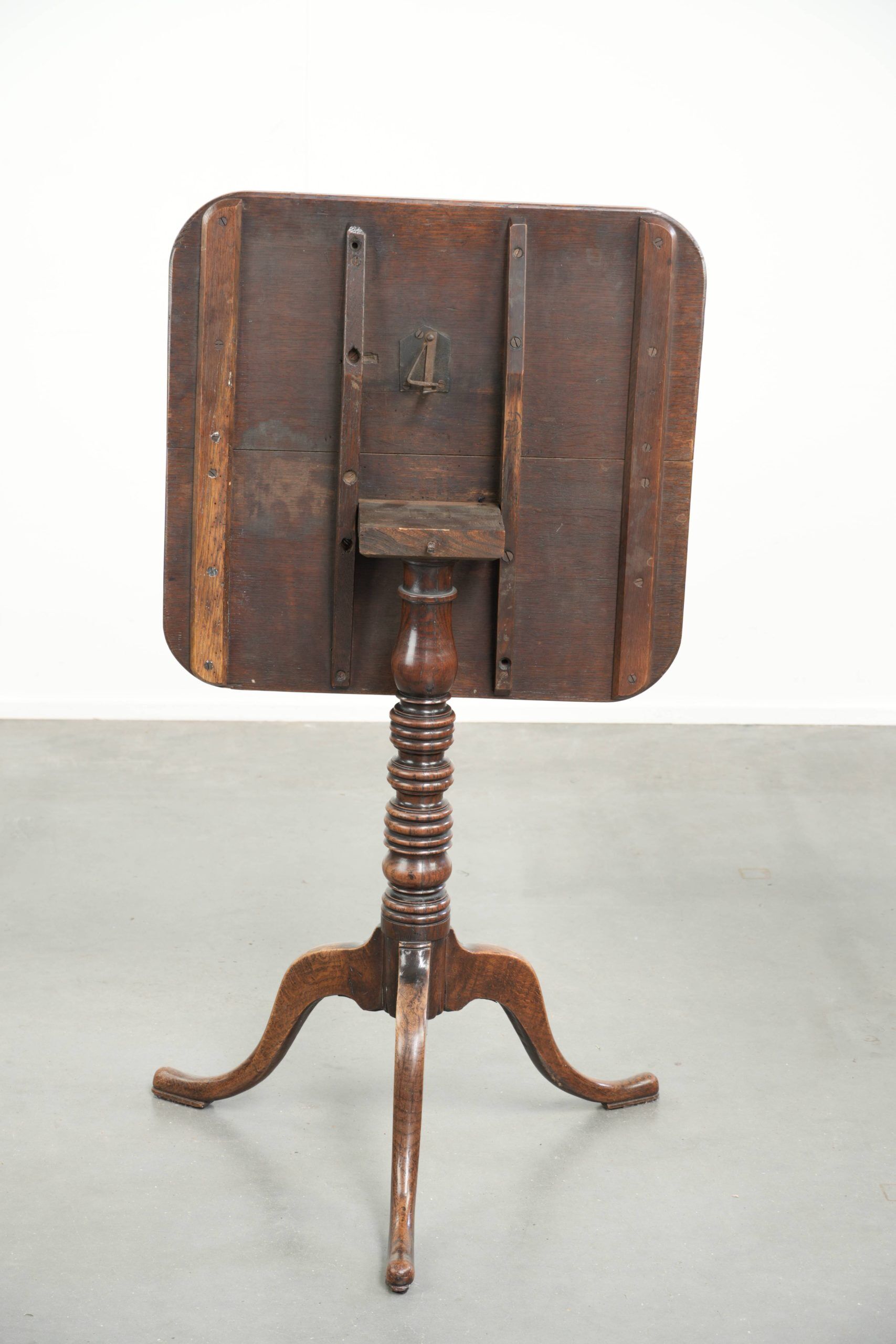 Antique English oak tilt top table from the 19th century in a unique shape