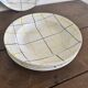 Vintage Longchamp France service – 18 graphic plates from the 1950s.