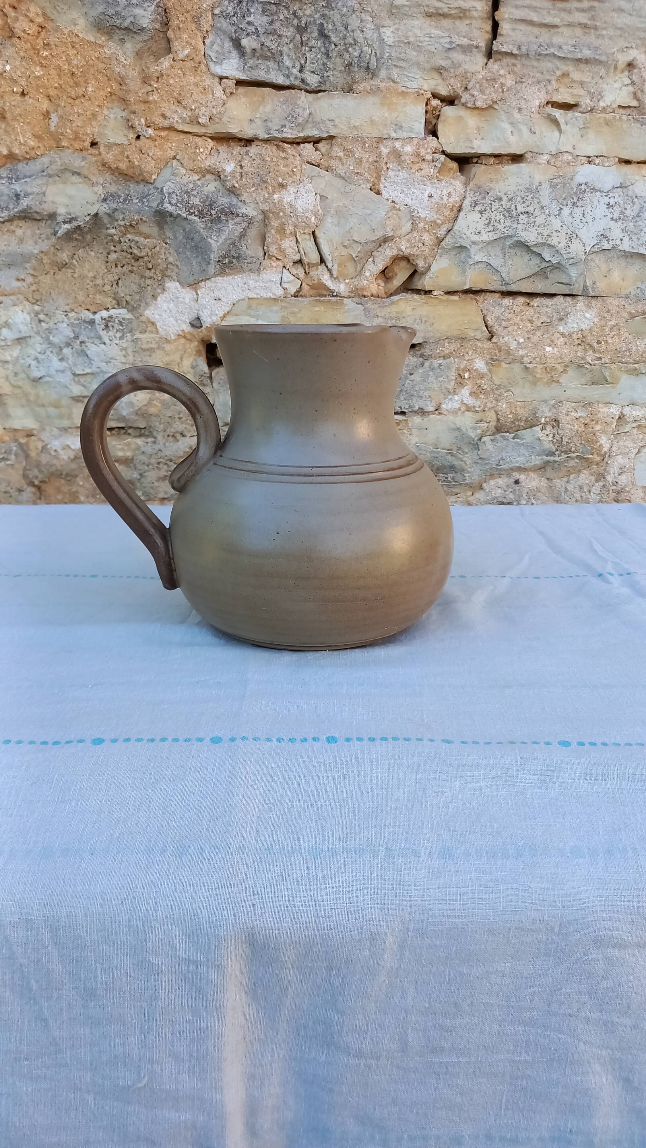 Pitcher in flowery sandstone