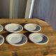 Set of 9 small Italian dessert plates Primula with red and green trim.