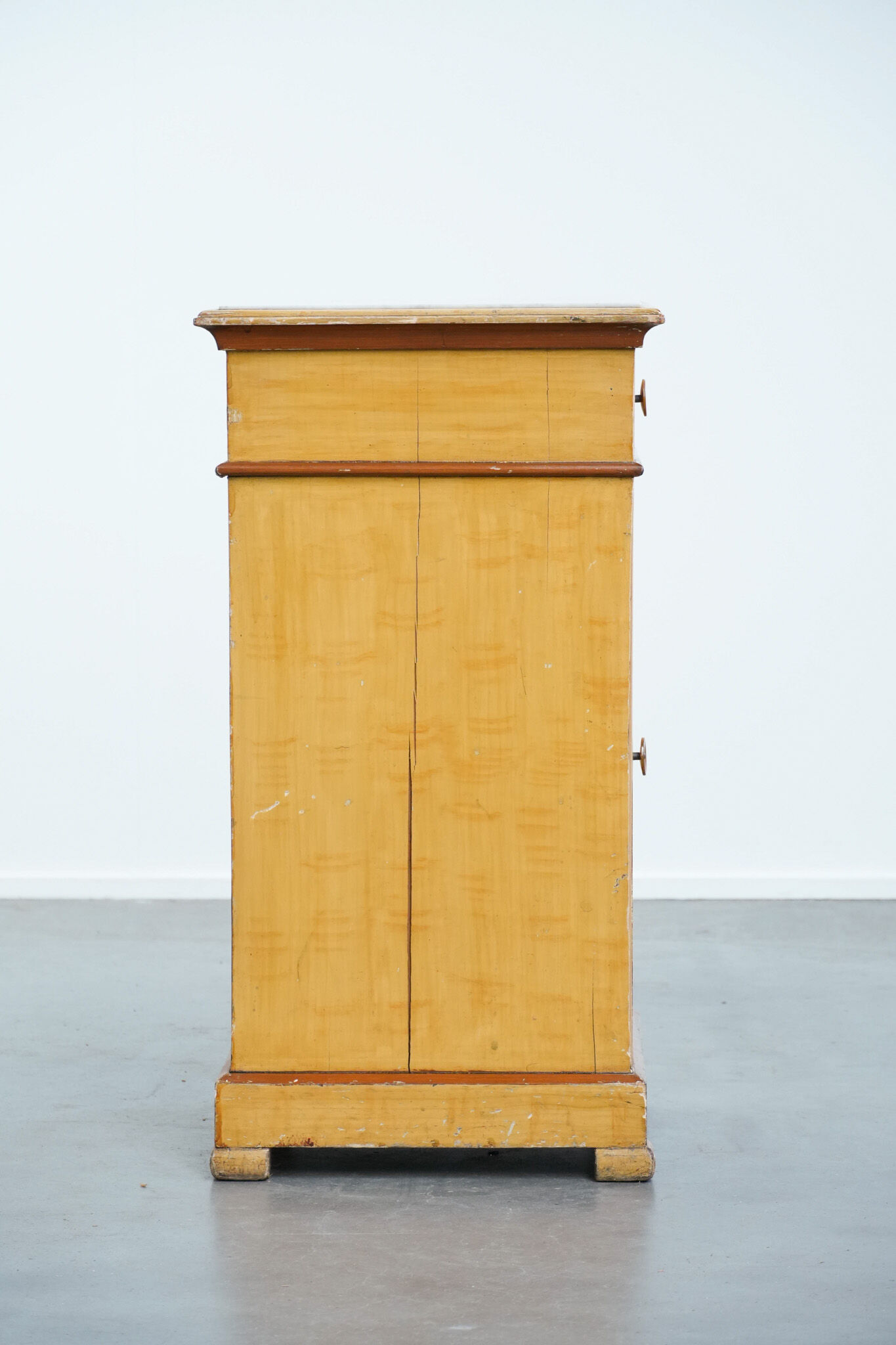 Antique wooden 1-door hallway/nightstand with a light marble top