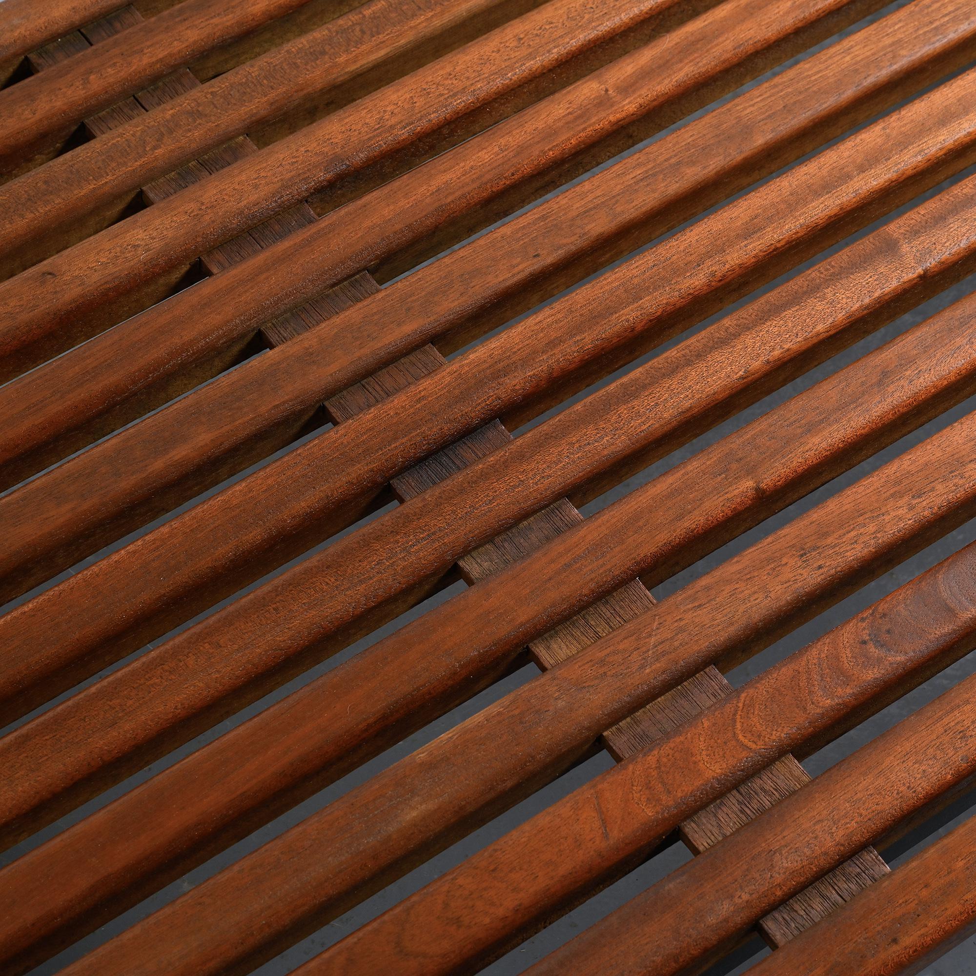 Cansado bench in mahogany by Charlotte Perriand, circa 1962.
