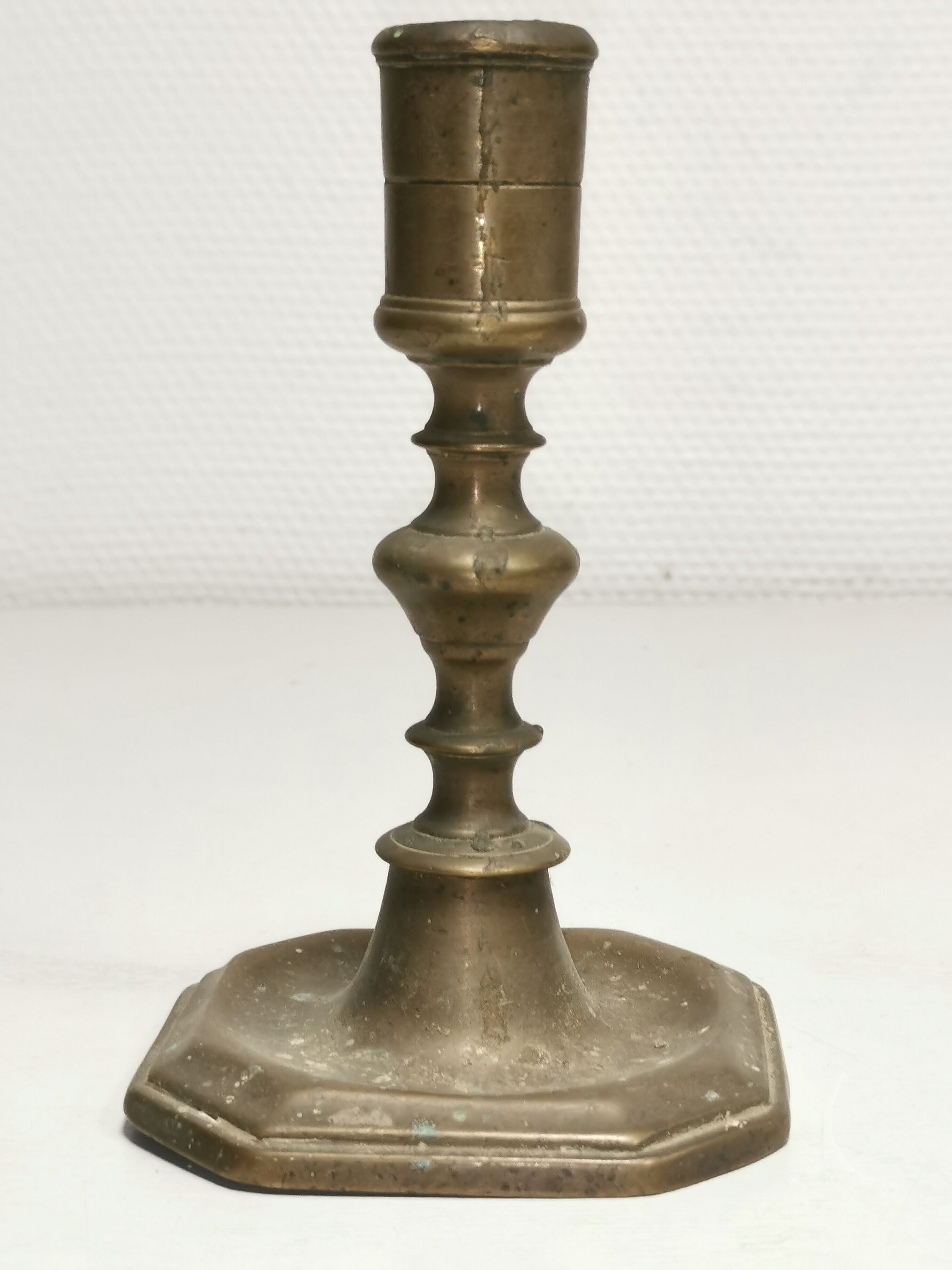 Old bronze candle holder, seventeenth century